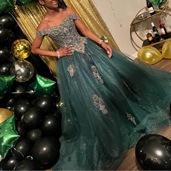 Elegant Green Off-Shoulder Gown with Gold Embellishments - www.panoramagroup.in Elegant Green Off-Shoulder Gown with Gold Embellishments - www.panoramagroup.in